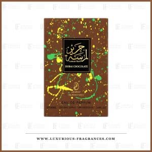 Coffret du parfum Lamsat Harir Dubai Chocolate d'Arabiyat Prestige, etui marron chocolat eclabousse de jaune et de vert